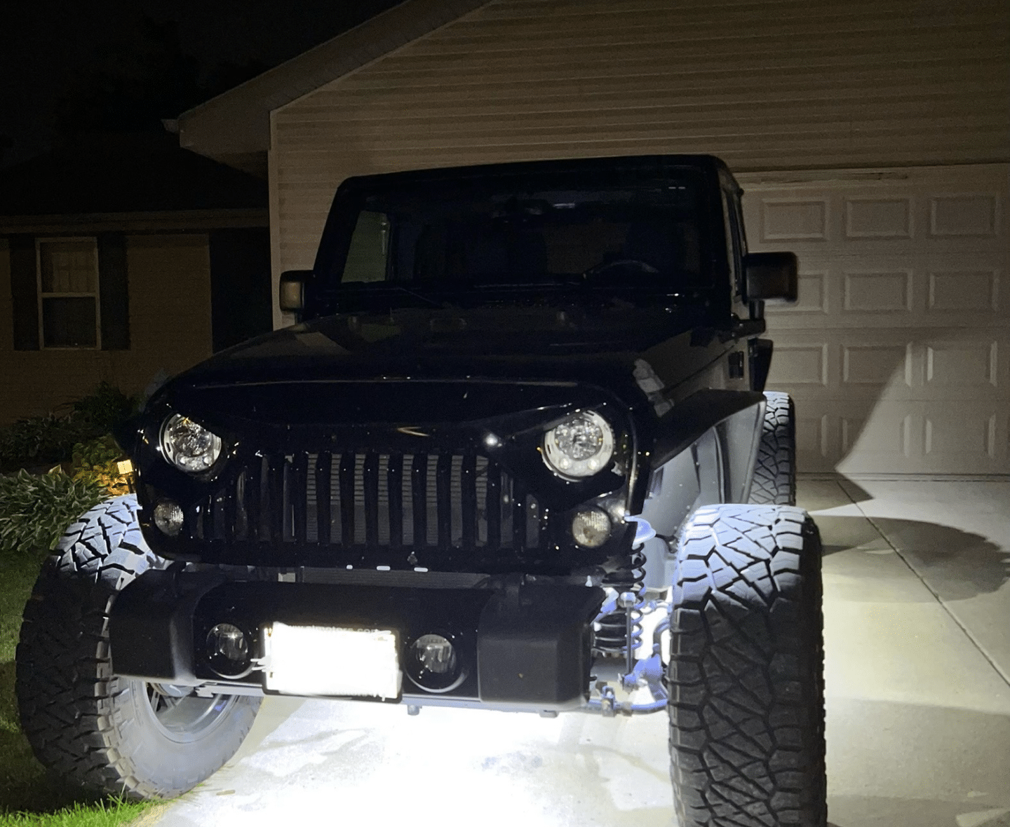 Valley City Automotive in Eau Claire, WI. image of a black car with it's under car lights on