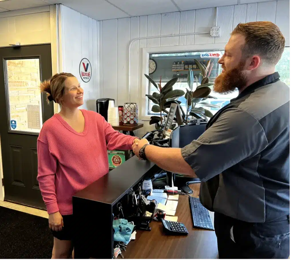 Valley City Automotive Auto repair shop in Eau Claire, WI. A man shaking hands with a woman