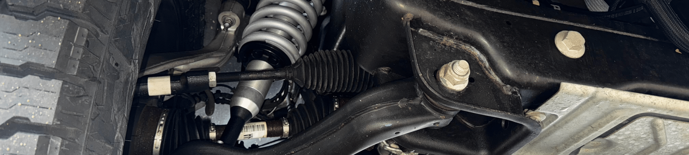 Suspension Repair in Eau Claire, WI at Valley City Automotive. A close image of a car's suspension system.